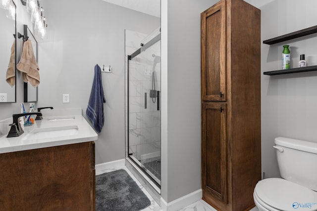 7110 New Bethel Rd, Hokes Bluff, AL 35903 - full bathroom with toilet, a stall shower, marble look tiles, baseboards, and double vanity