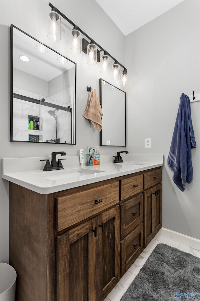7110 New Bethel Rd, Hokes Bluff, AL 35903 - bathroom with double vanity, a shower stall, baseboards, and tile patterned floors