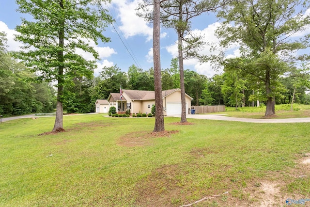 7110 New Bethel Rd, Hokes Bluff, AL 35903 - view of front facade featuring driveway, a garage, and view of wooded area