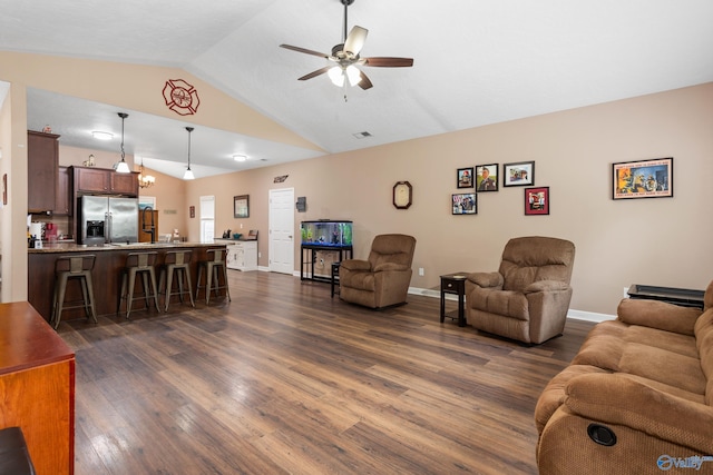 7110 New Bethel Rd, Hokes Bluff, AL 35903 - living room featuring vaulted ceiling, dark wood-style floors, ceiling fan, and baseboards