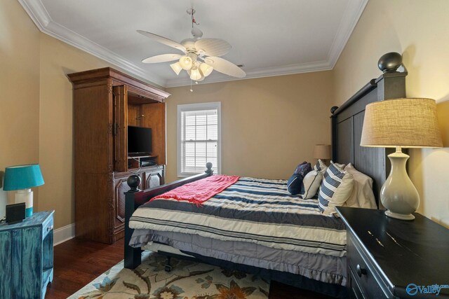 bedroom featuring dark hardwood / wood-style floors, ceiling fan, and ornamental molding