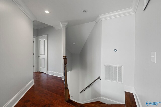 corridor with crown molding and hardwood / wood-style floors