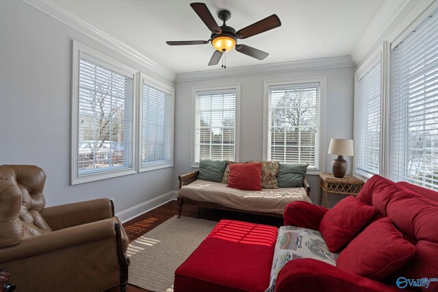 living room with ceiling fan, crown molding, hardwood / wood-style flooring, and a wealth of natural light