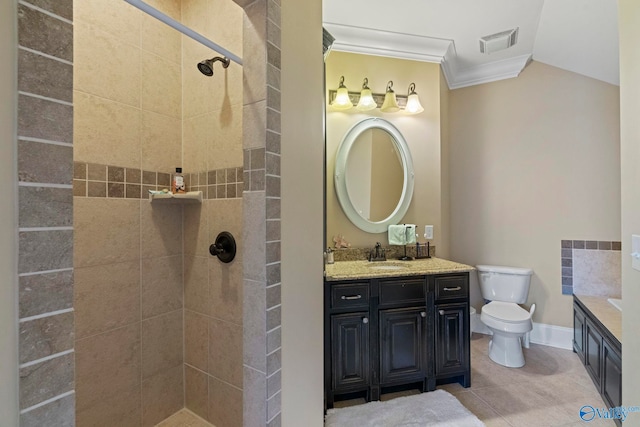 bathroom with toilet, tile patterned floors, crown molding, and a tile shower