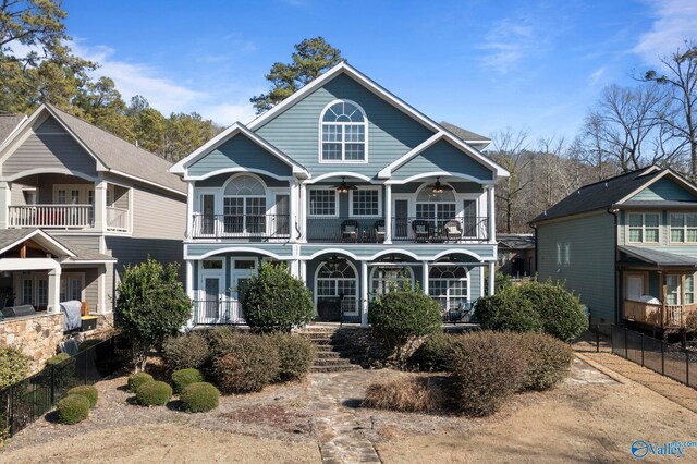 view of front of house featuring a balcony