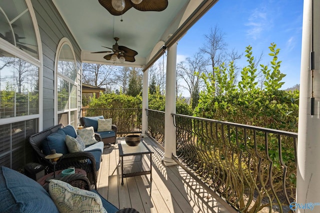 exterior space with an outdoor living space and ceiling fan