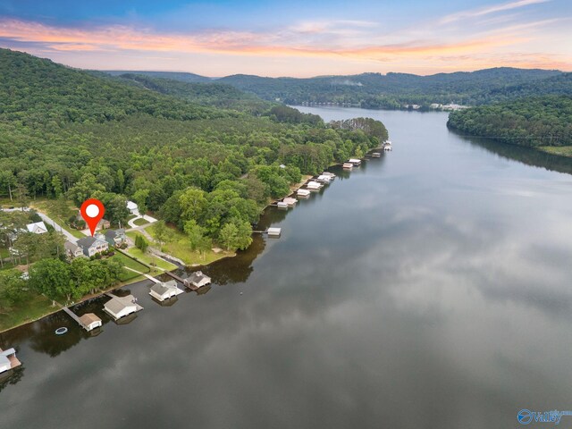 aerial view at dusk with a water view