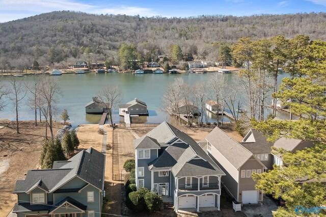 birds eye view of property featuring a water view