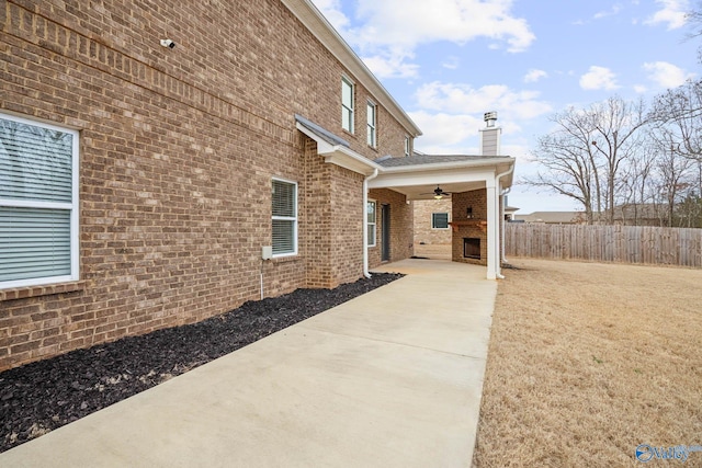 view of property exterior featuring ceiling fan and a patio