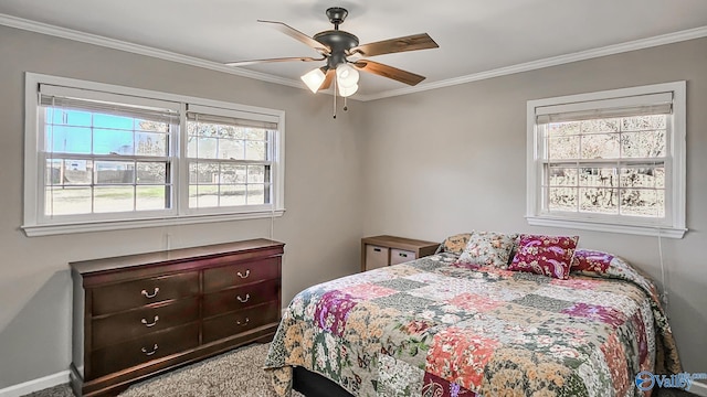 bedroom with carpet, ceiling fan, crown molding, and multiple windows