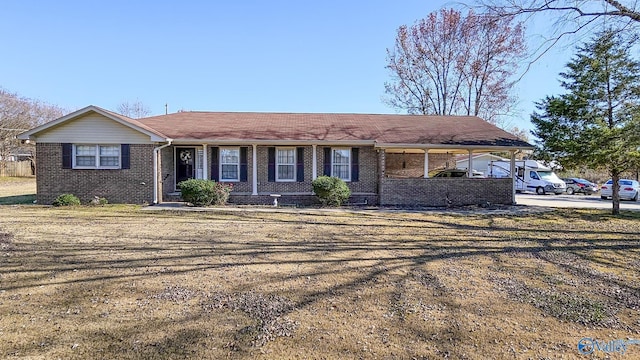 single story home featuring a carport