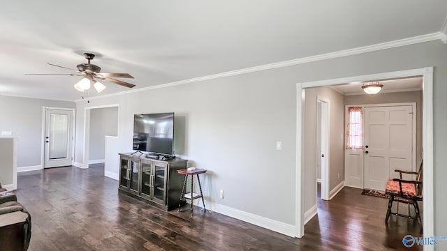 living room featuring dark hardwood / wood-style floors, ceiling fan, and ornamental molding