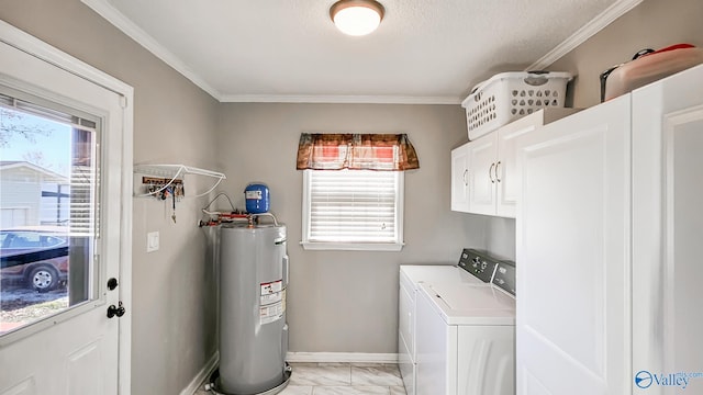 laundry room with a wealth of natural light, electric water heater, cabinets, and independent washer and dryer