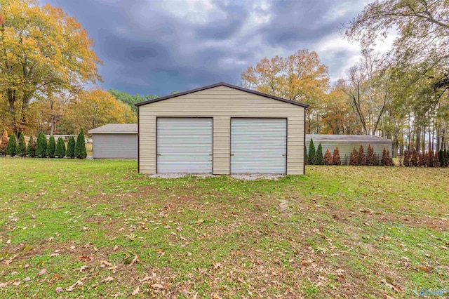 garage with a yard