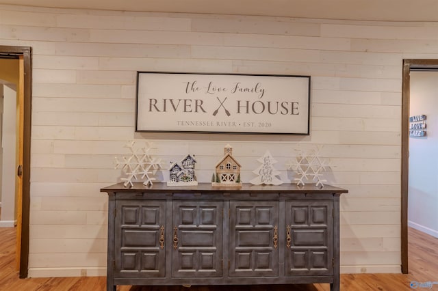 bar featuring light hardwood / wood-style flooring