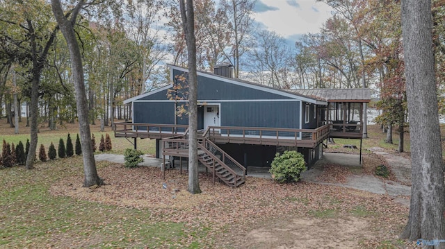 back of house with a wooden deck