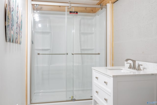 bathroom with vanity and an enclosed shower