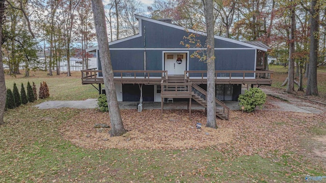 back of house featuring a deck