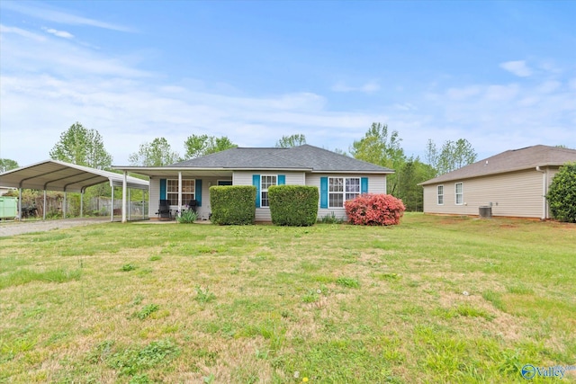 1004 Carter Grove Rd, Hazel Green, AL 35750 - ranch-style home with dirt driveway, a detached carport, and a front yard