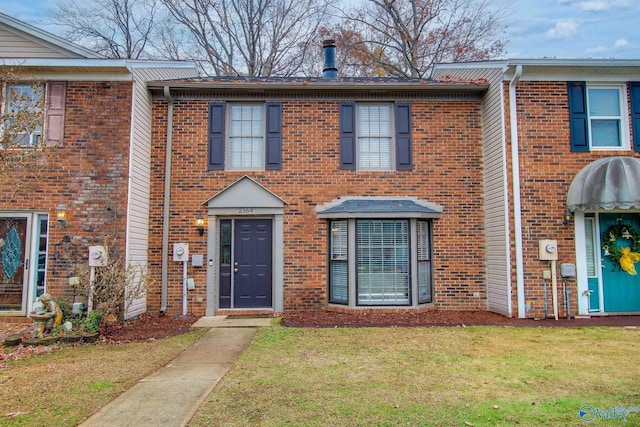 view of property with a front lawn