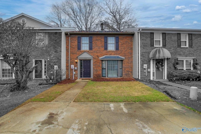 view of property with a front lawn