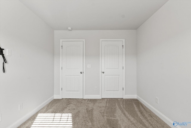 unfurnished bedroom featuring carpet