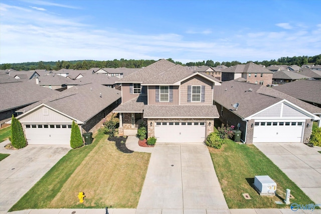 view of front of home featuring a garage and a front lawn