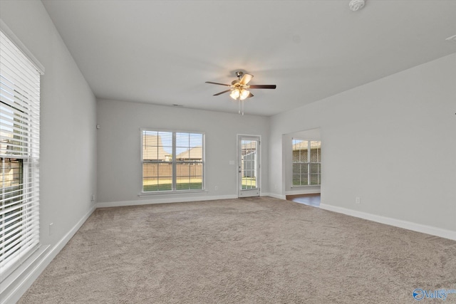 carpeted empty room with ceiling fan