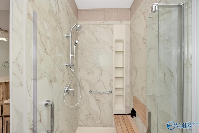 full bath featuring a marble finish shower