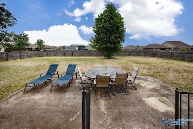 view of patio / terrace with outdoor dining space and a fenced backyard