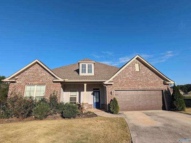 front of property with a front yard and a garage