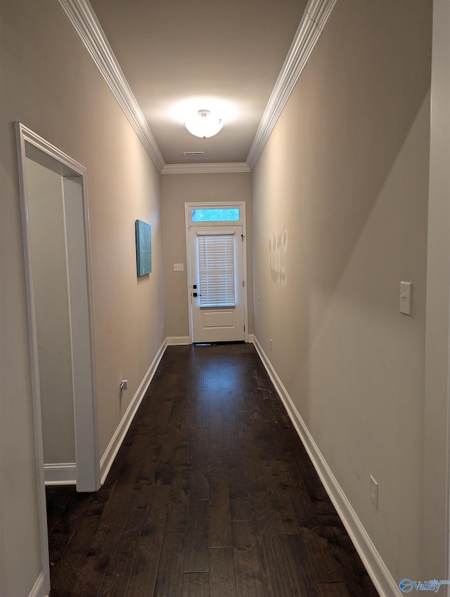 doorway to outside with dark wood-type flooring and ornamental molding