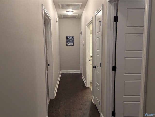 corridor featuring dark hardwood / wood-style flooring