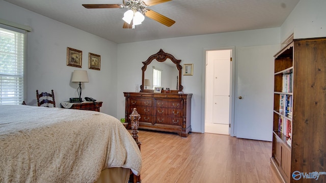 bedroom with light wood-style floors and ceiling fan