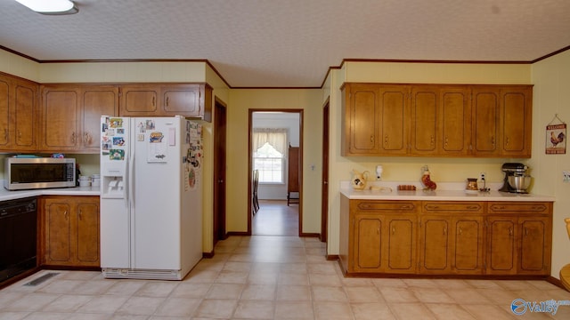kitchen featuring stainless steel microwave, brown cabinets, black dishwasher, and white fridge with ice dispenser