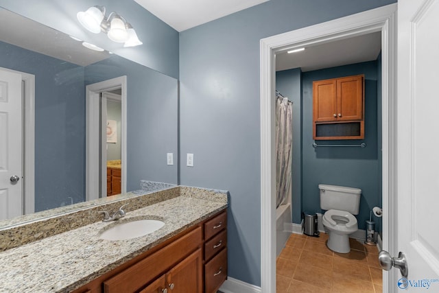full bathroom with vanity, shower / tub combo with curtain, toilet, baseboards, and tile patterned floors