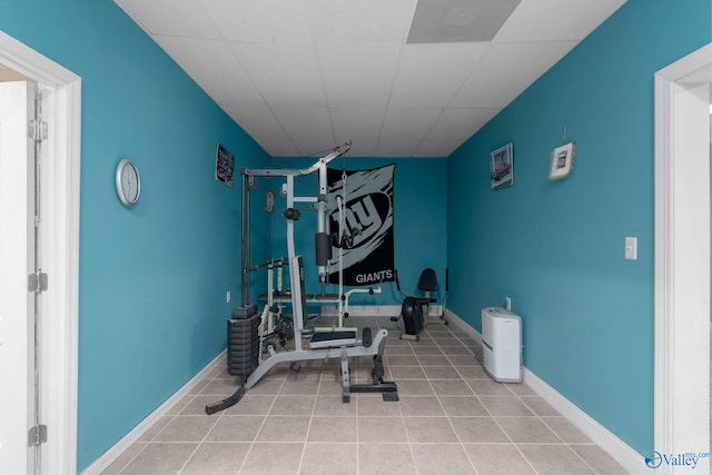 workout area featuring tile patterned floors