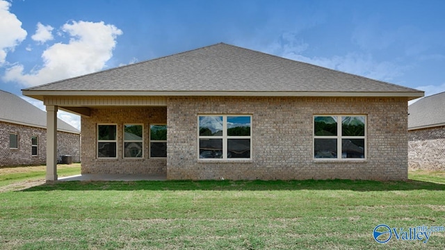 rear view of house with a lawn