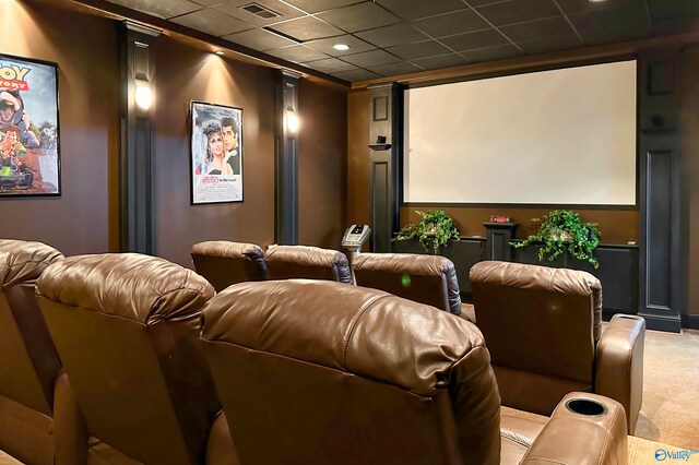 home theater room with carpet floors and a drop ceiling