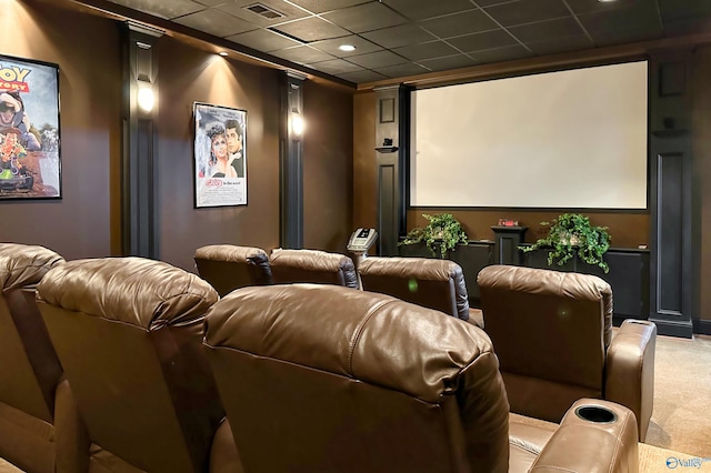 home theater room featuring carpet floors, visible vents, and a drop ceiling