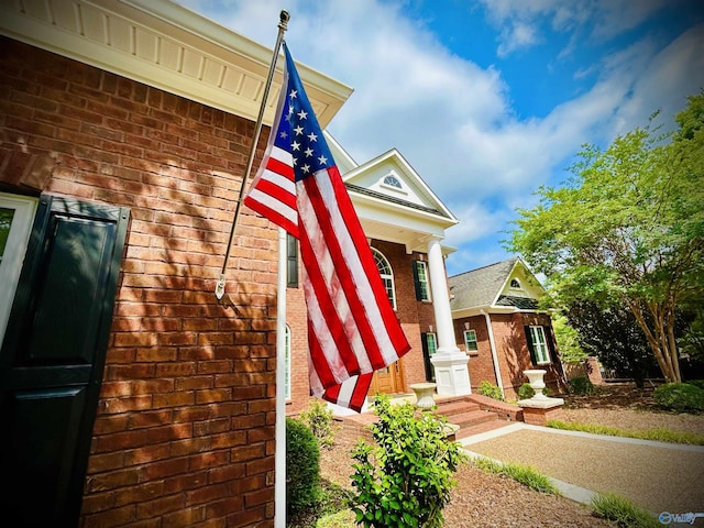 exterior space featuring brick siding