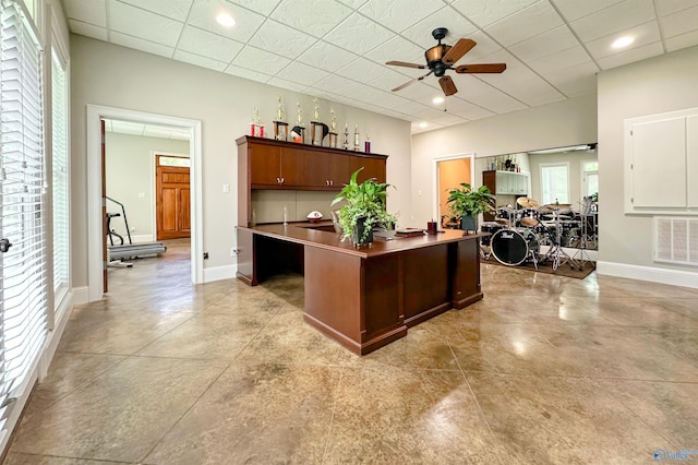 office area featuring a drop ceiling, visible vents, baseboards, recessed lighting, and ceiling fan