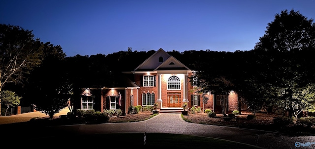 view of front of house with brick siding