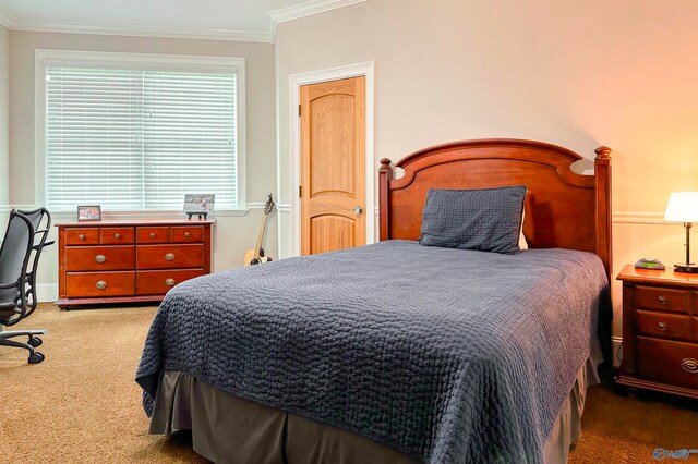 carpeted bedroom featuring crown molding