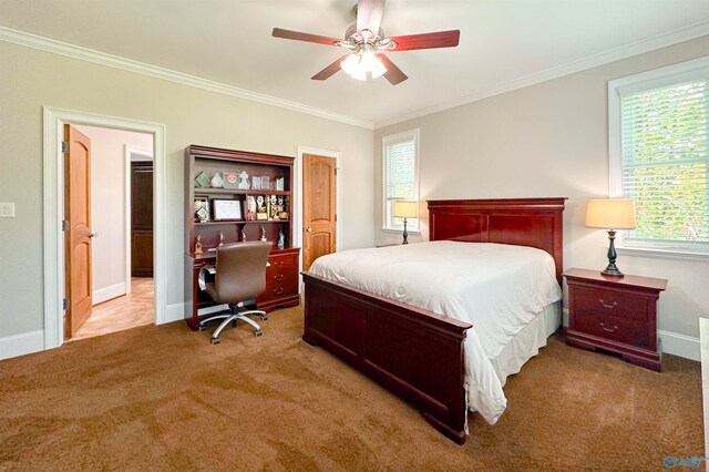 bedroom featuring ornamental molding, light colored carpet, and ceiling fan