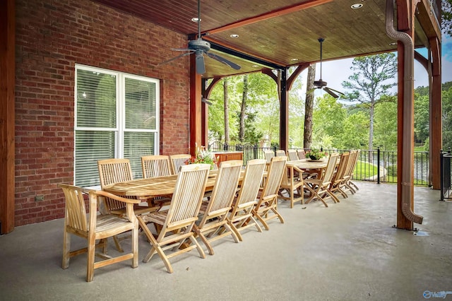 view of patio / terrace featuring fence, a ceiling fan, and outdoor dining area