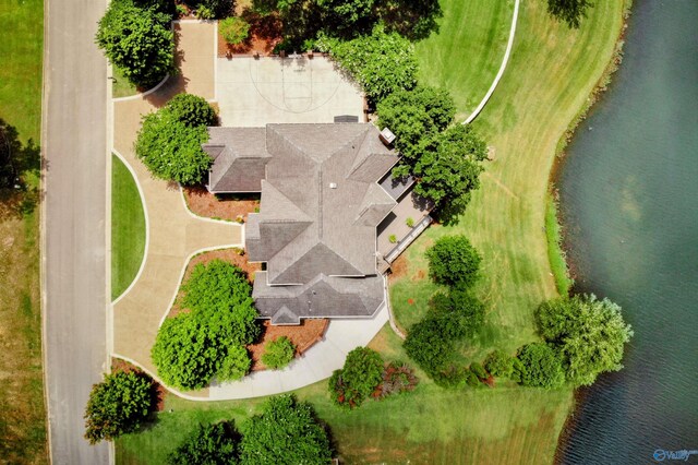 birds eye view of property with a water view