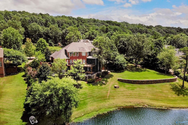 bird's eye view with a view of trees and a water view
