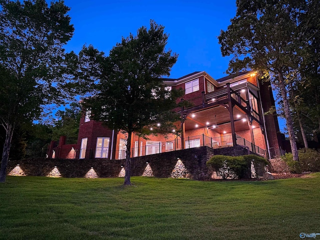 back house at night with a lawn