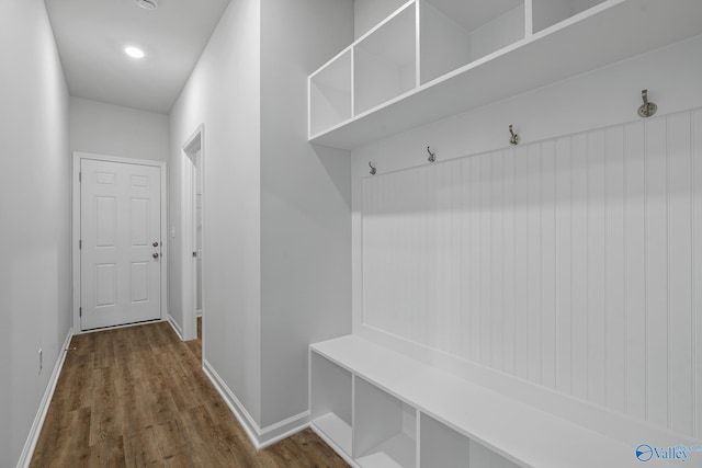 mudroom with baseboards and dark wood-style flooring